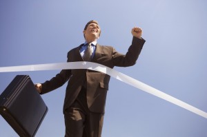 Businessman Crossing the Finish Line Businessman Crossing the Finish Line